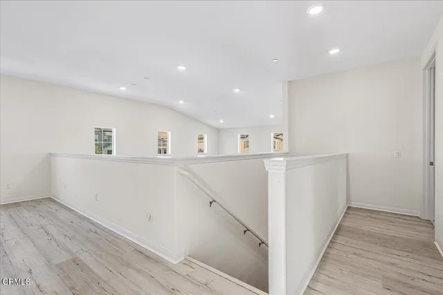 a view of a patio with a table and chairs next to a yard