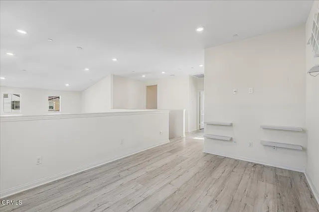 a view of a patio with table and chairs potted plants and a palm tree