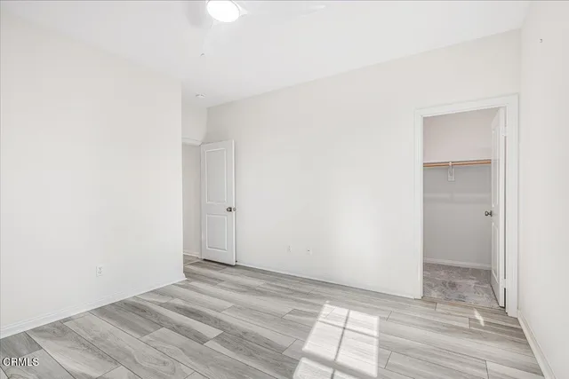a large kitchen with a counter and a chandelier