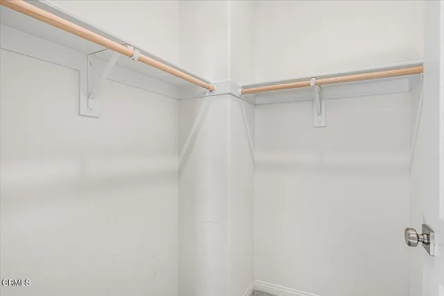 a kitchen with counter top space and living room