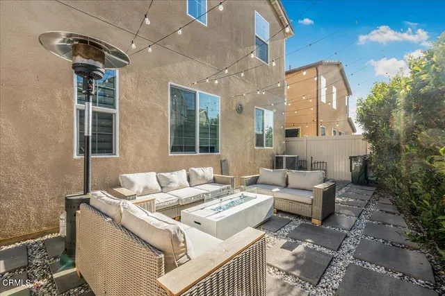 a kitchen with stainless steel appliances granite countertop wooden cabinets a refrigerator a sink a stove a microwave and island