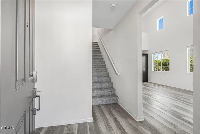 a bathroom with a shower a toilet and a sink