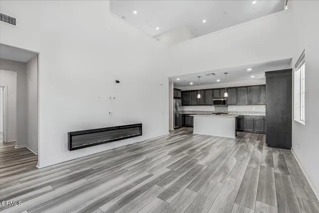 a spacious bathroom with a double vanity sink a mirror and a bathtub
