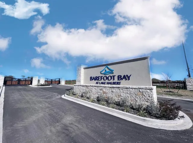 a view of a street with a building in the background