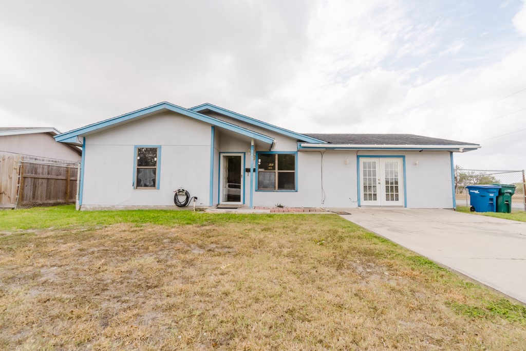 1401 Barcelona Drive Corpus Christi, TX 78416 - Photo 1 of 13 front view of a house with a yard