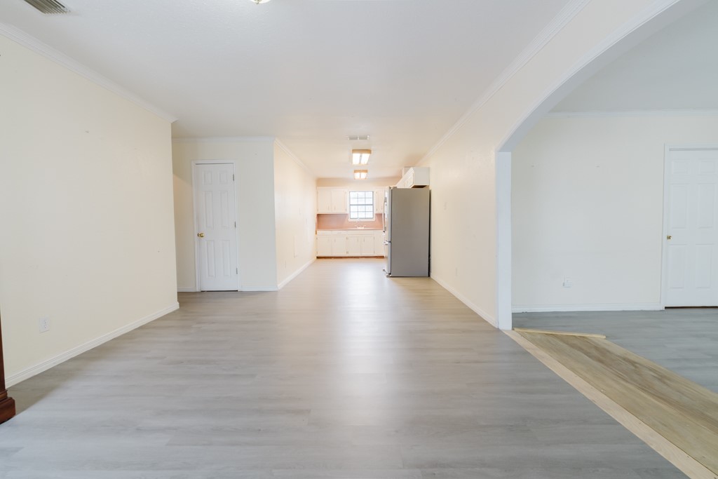 1401 Barcelona Drive Corpus Christi, TX 78416 - Photo 4 of 13 a view of a big room with wooden floor and windows