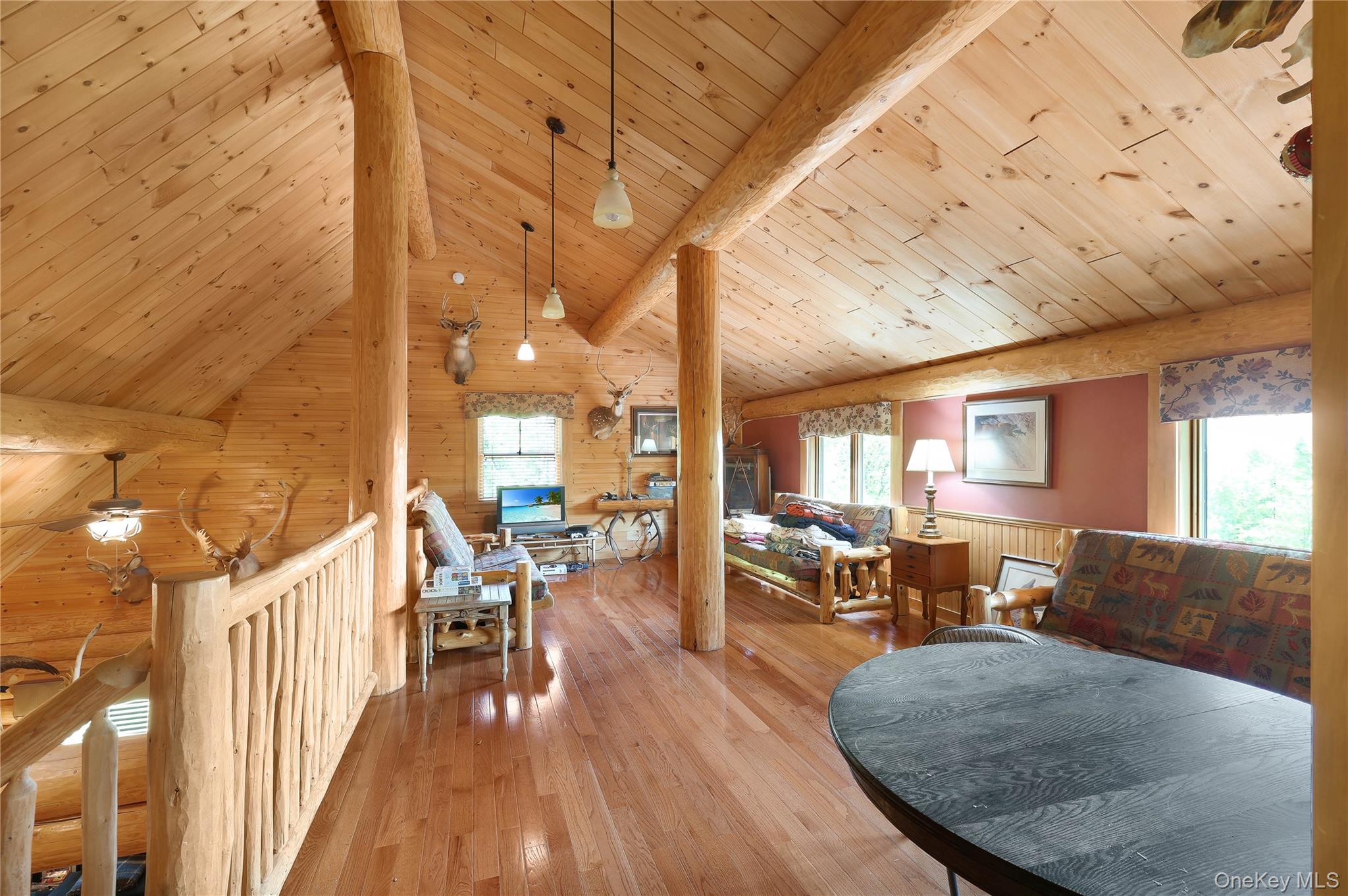 25 Cauthers Road Fallsburg, NY 12789 - Photo 15 of 27 a view of a dining room with furniture window and wooden floor