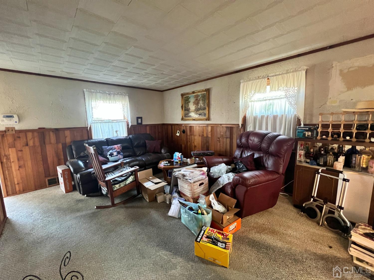 118 MacArthur Drive Edison, NJ 08837 - Photo 2 of 16 a living room with furniture a window and gym equipment