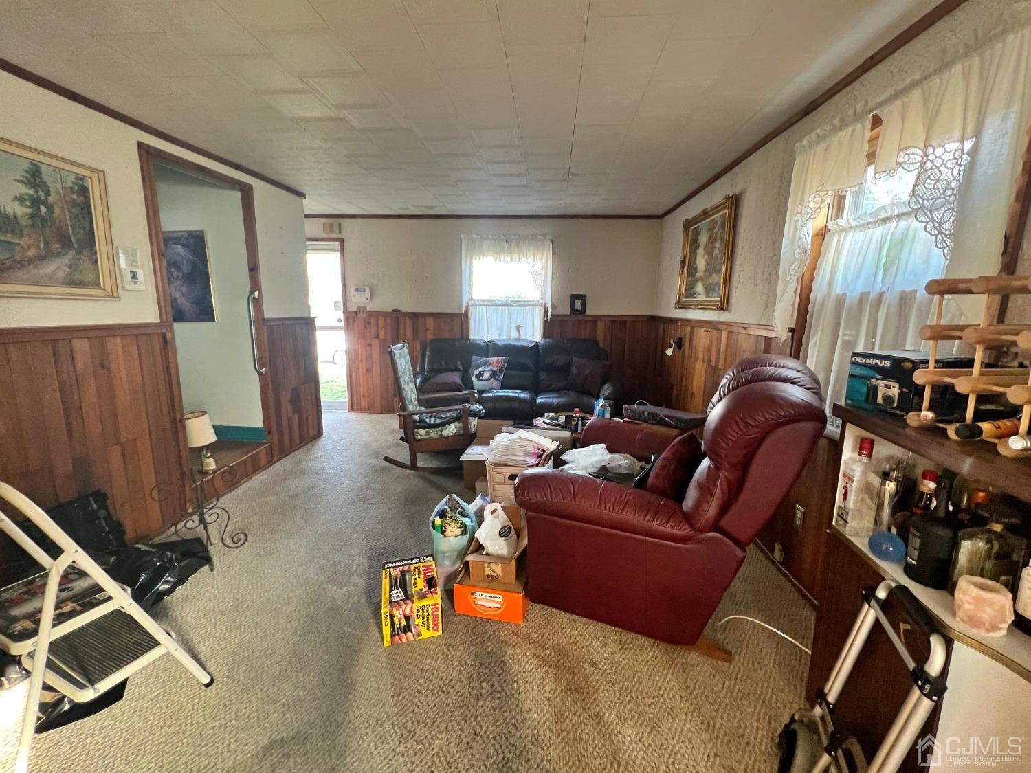 118 MacArthur Drive Edison, NJ 08837 - Photo 3 of 16 a living room with furniture gym equipment and a large window