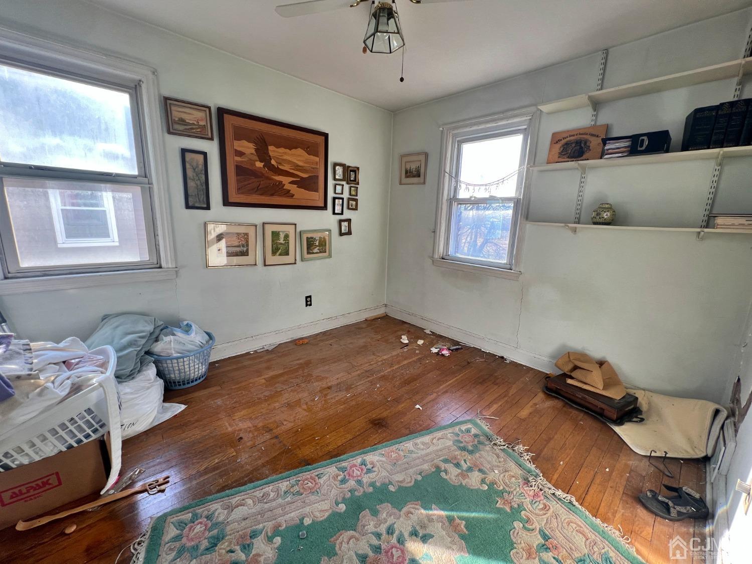 118 MacArthur Drive Edison, NJ 08837 - Photo 10 of 16 a bedroom with a bed and wooden floor