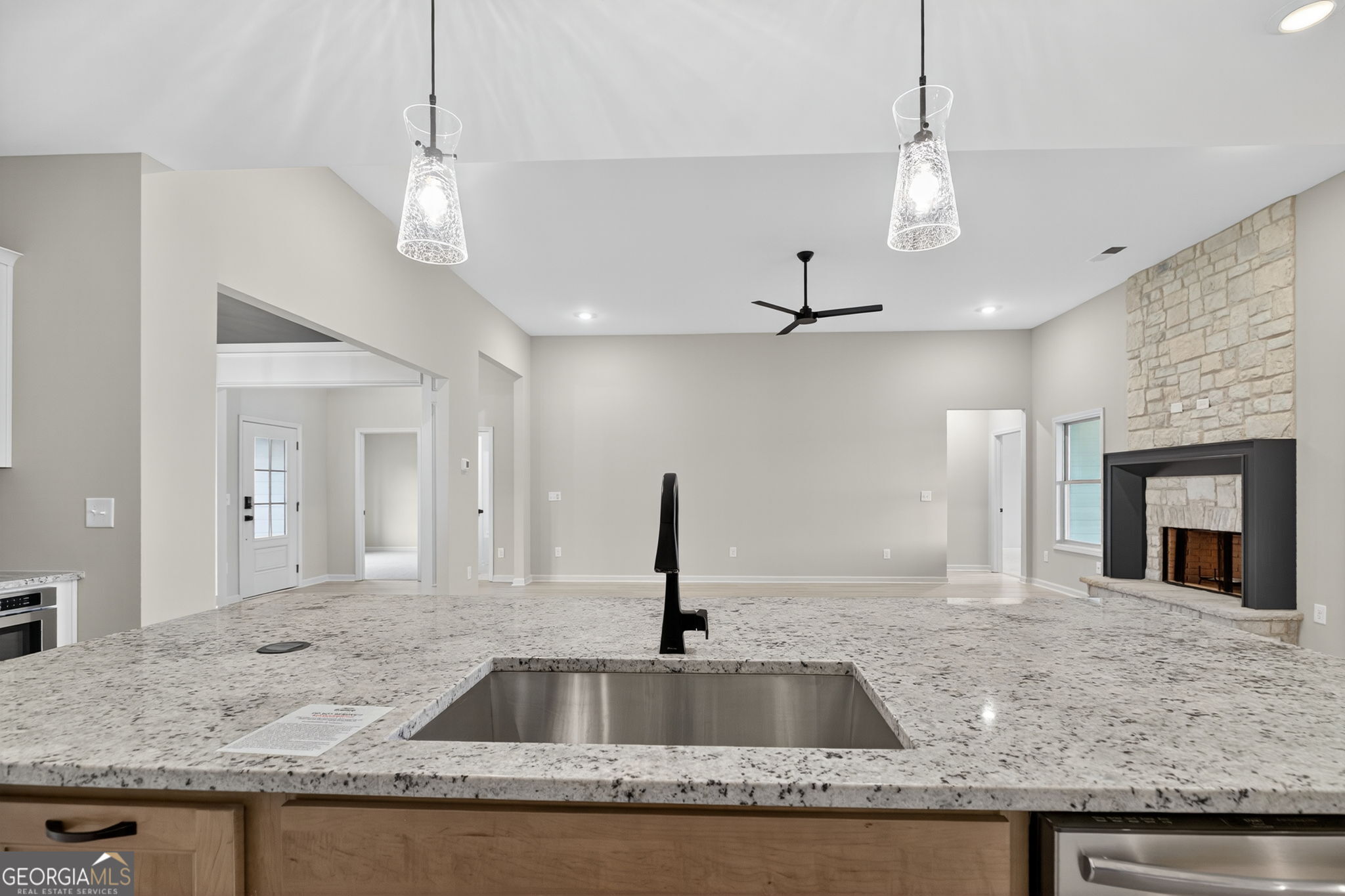 359 Gray Road Roopville, GA 30170 - Photo 20 of 46 a kitchen with granite countertop a sink and a refrigerator