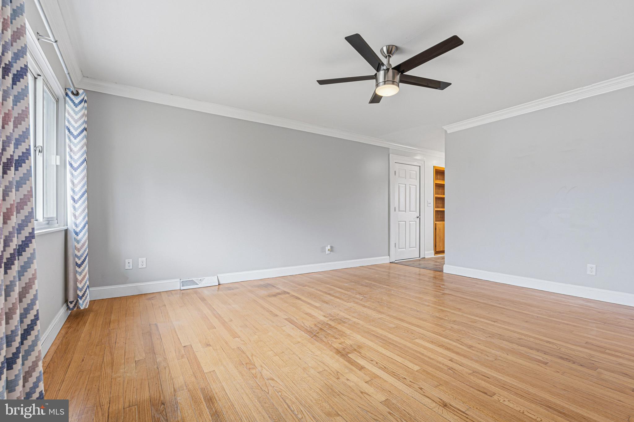 603 Tupelo Court Edgewood, MD 21040 - Photo 13 of 40 an empty room with wooden floor and ceiling fan
