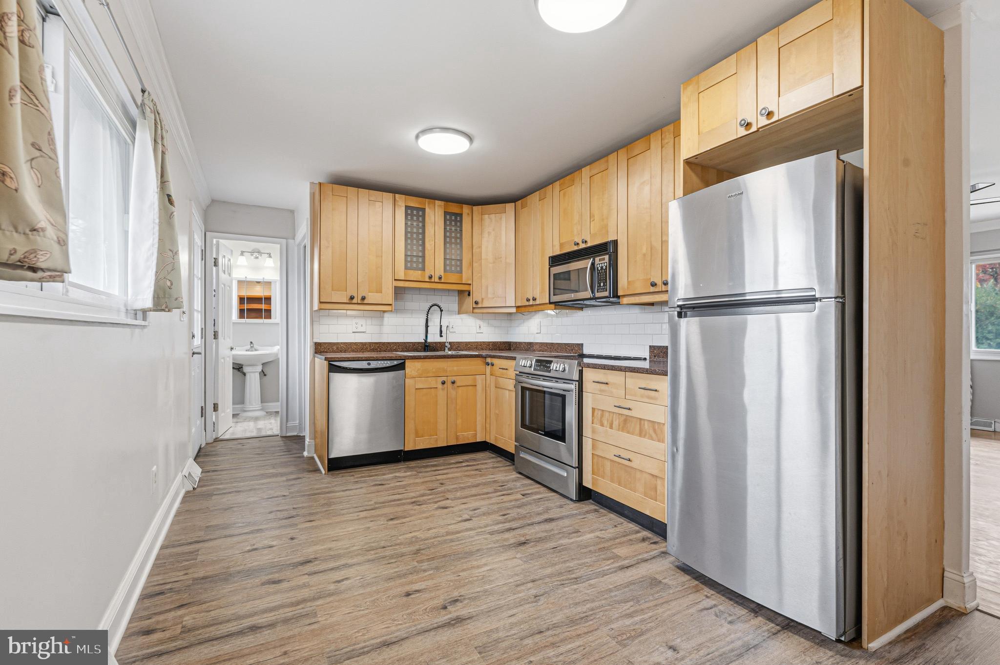 603 Tupelo Court Edgewood, MD 21040 - Photo 16 of 40 a kitchen with white cabinets and white appliances