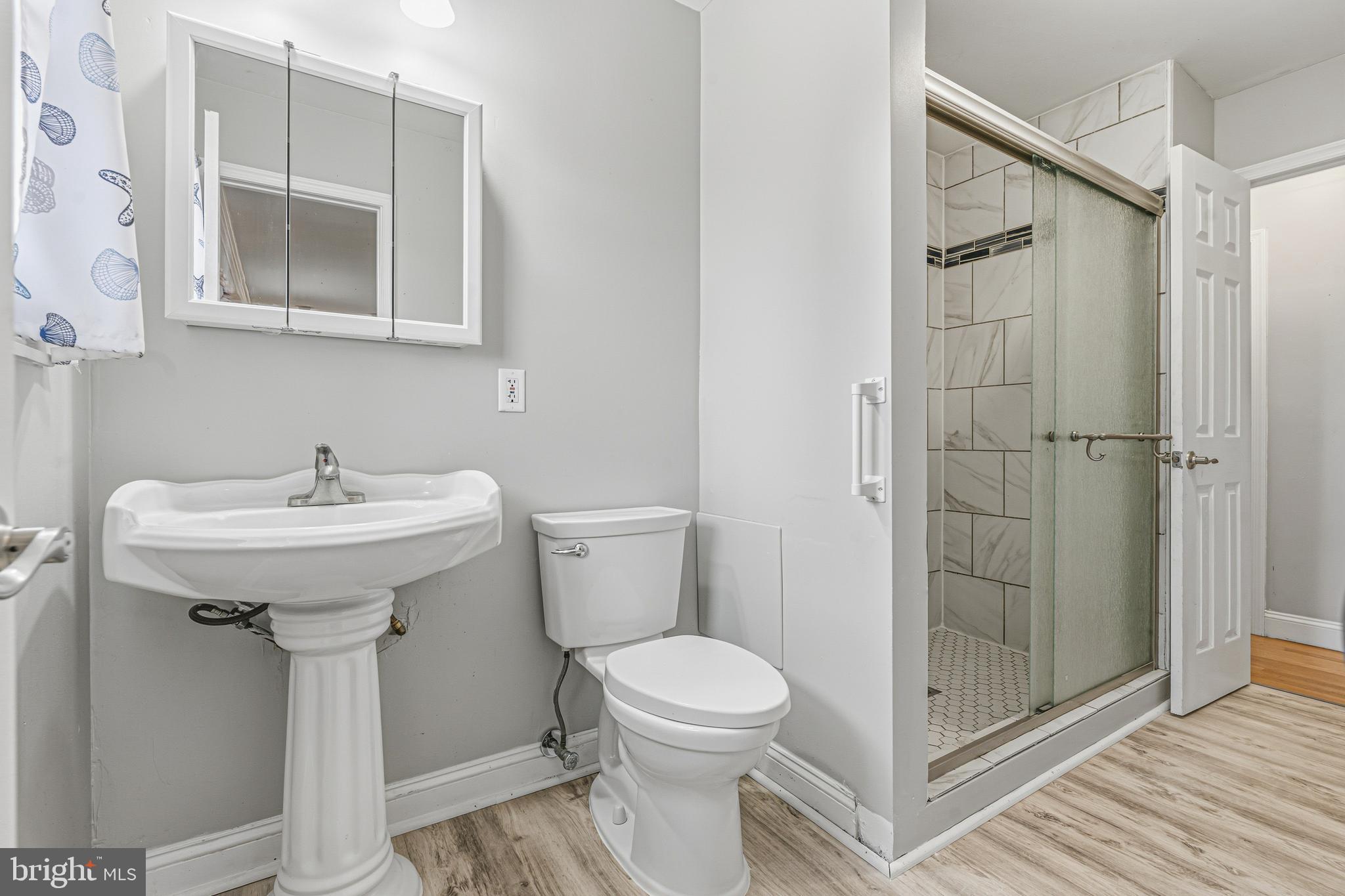 603 Tupelo Court Edgewood, MD 21040 - Photo 19 of 40 a bathroom with a sink toilet and shower