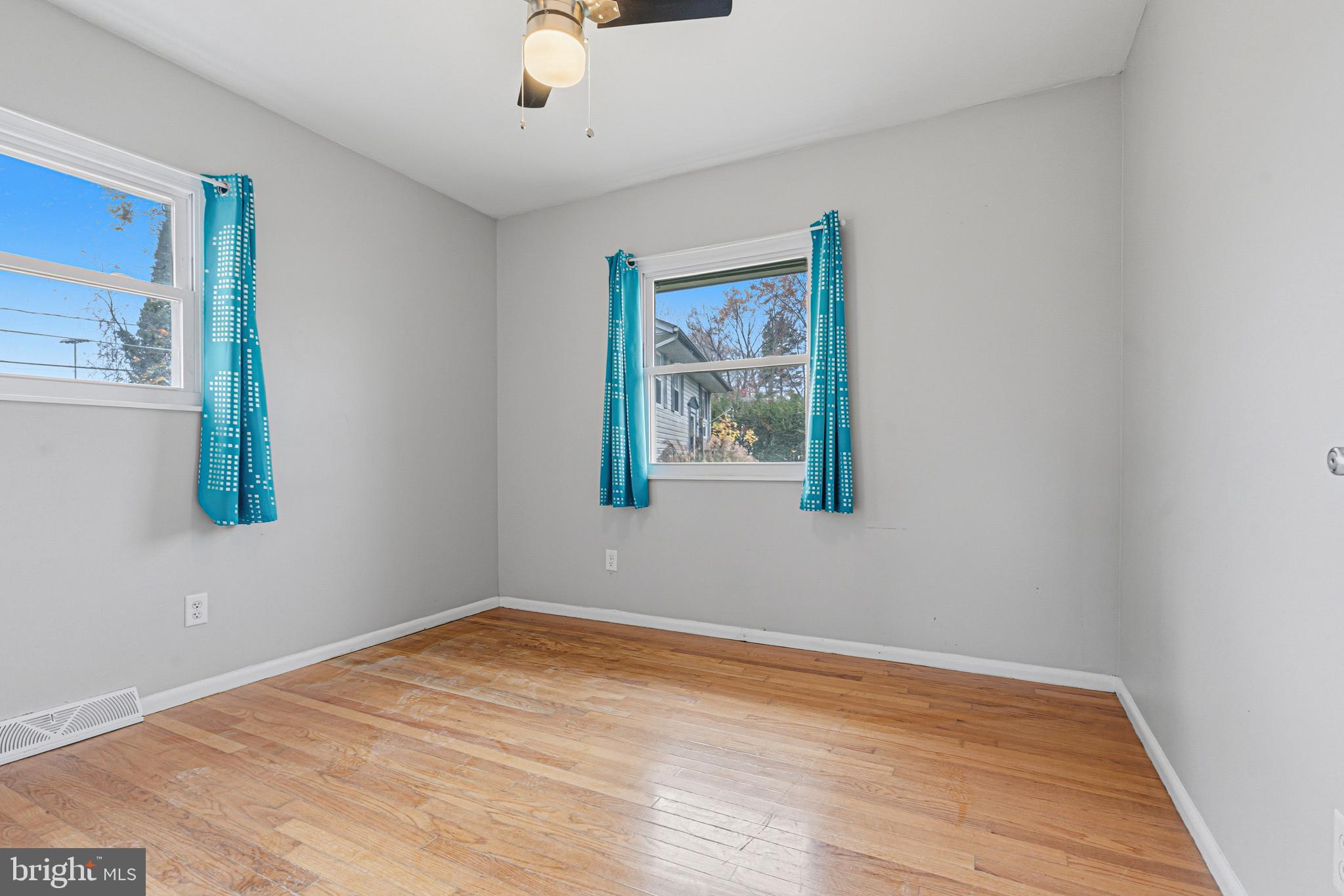603 Tupelo Court Edgewood, MD 21040 - Photo 27 of 40 a view of an empty room with wooden floor and a window