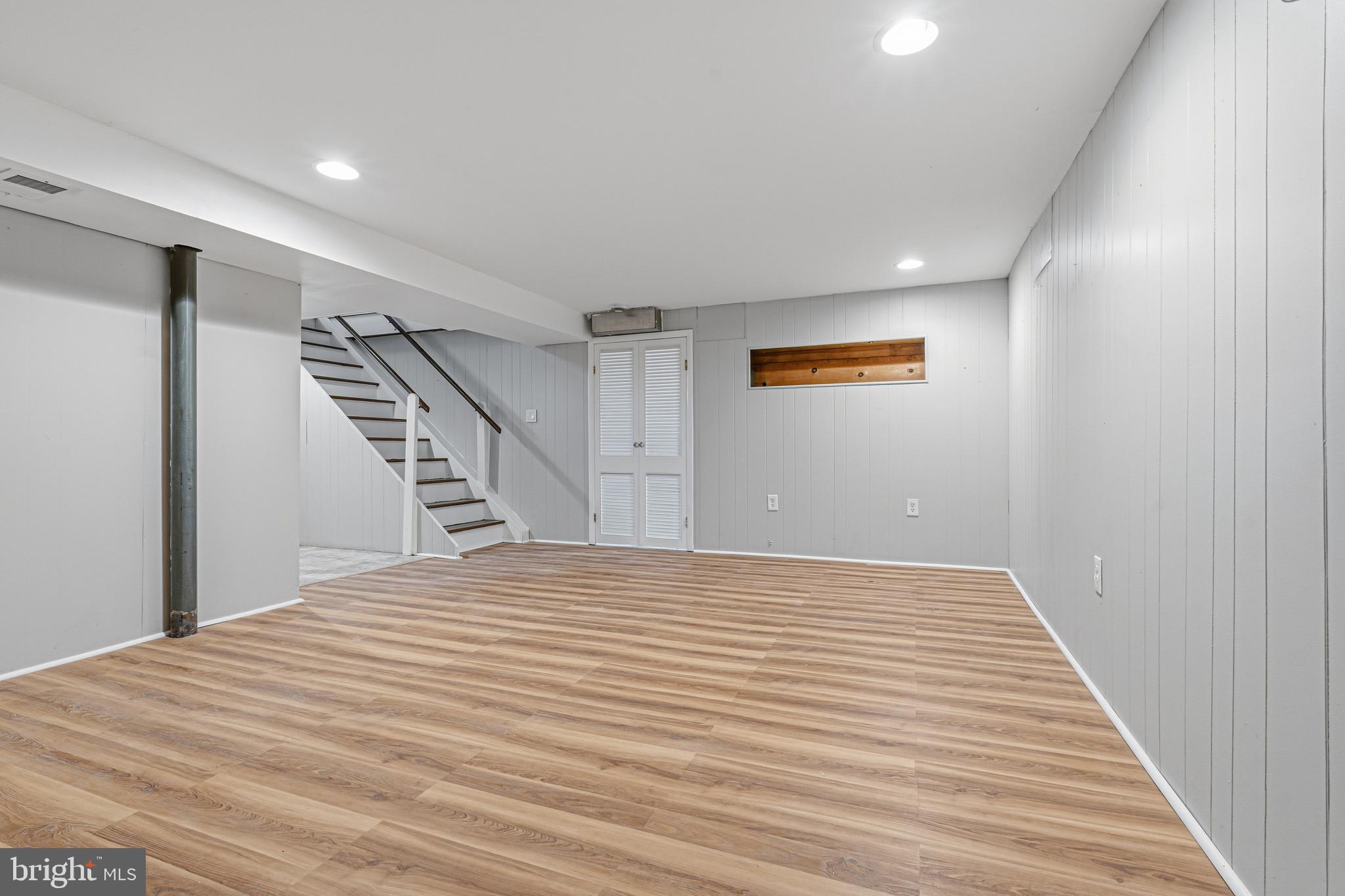 603 Tupelo Court Edgewood, MD 21040 - Photo 33 of 40 a view of a big room with wooden floor and stairs