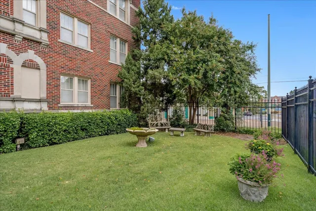 a backyard of a house with outdoor seating