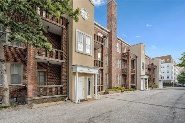 a city street lined with buildings and trees