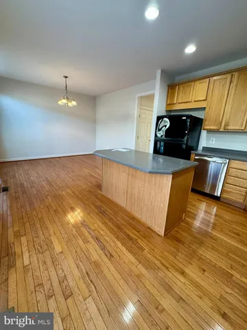 a view of kitchen with furniture and wooden floor