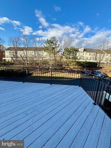 a view of a balcony with wooden floor