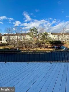 a view of a balcony with wooden floor
