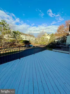 a view of outdoor space with wooden floor and city view
