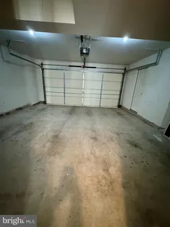 an aerial view of a houses with outdoor space and city view