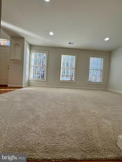 a view of an empty room with windows