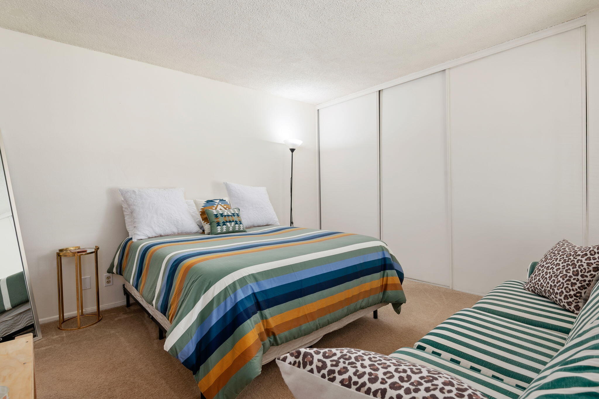 7304 Elmhurst Place Goleta, CA 93117 - Photo 11 of 20 a bedroom with a bed and wooden floor