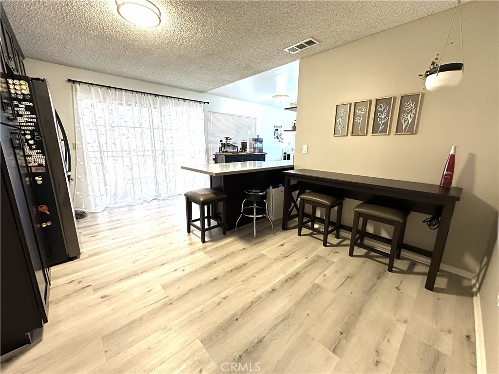 6830 Astoria Drive Riverside, CA 92503 - Photo 6 of 23 a view of a workspace with furniture and a window