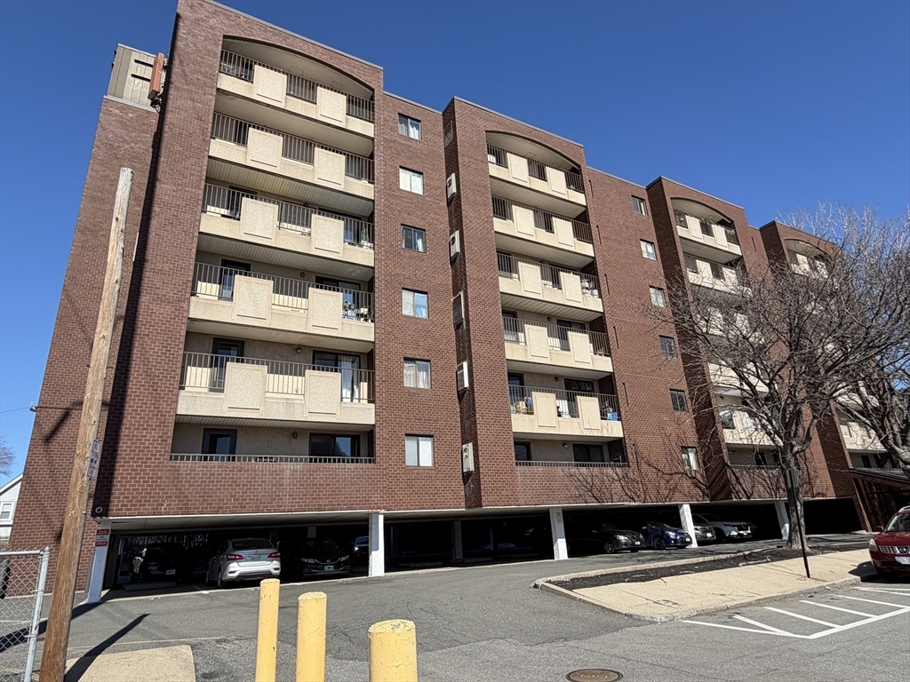 39 Parlin Street, Unit 203 Everett, MA 02149 - Photo 1 of 20 a front view of a building with a street