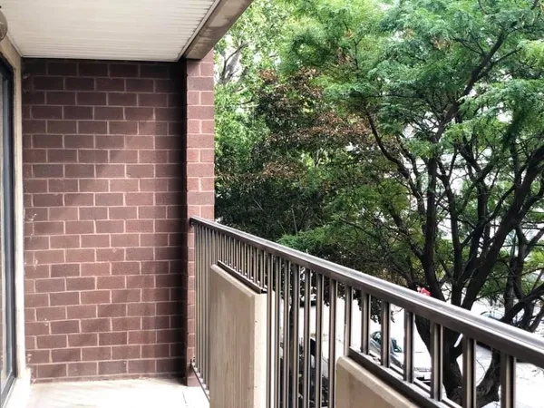 a view of a balcony with a pot
