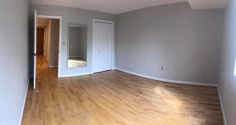 39 Parlin Street, Unit 203 Everett, MA 02149 - Photo 9 of 20 a view of empty room with wooden floor