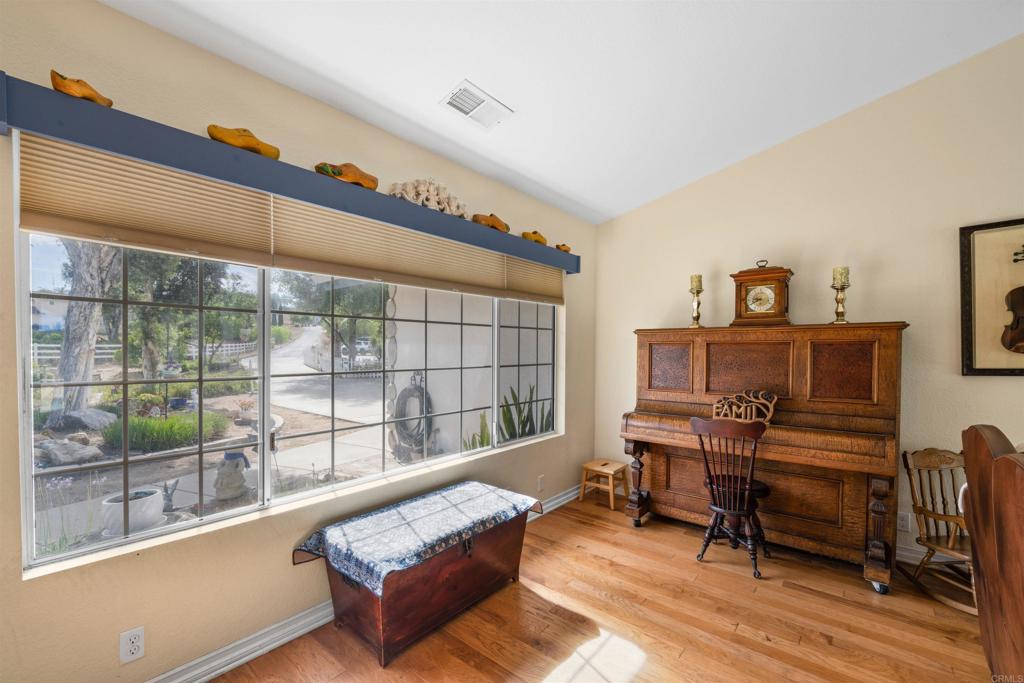 13995 Whispering Meadows Lane Jamul, CA 91935 - Photo 11 of 62 a living room with furniture and a gate