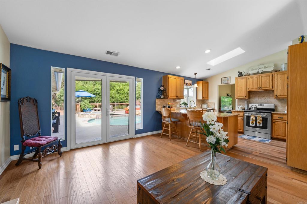 13995 Whispering Meadows Lane Jamul, CA 91935 - Photo 19 of 62 a living room with furniture and a large window
