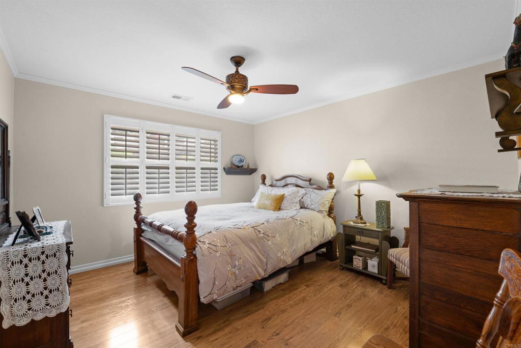 13995 Whispering Meadows Lane Jamul, CA 91935 - Photo 23 of 62 a bedroom with bed and a window