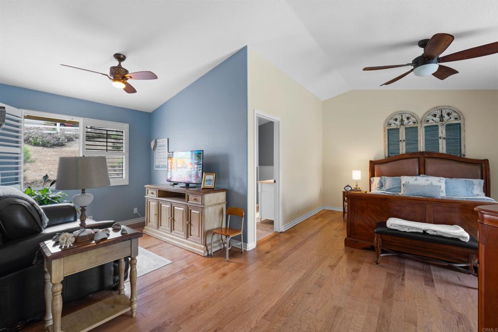 13995 Whispering Meadows Lane Jamul, CA 91935 - Photo 26 of 62 a living room with furniture and a fireplace