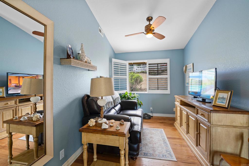 13995 Whispering Meadows Lane Jamul, CA 91935 - Photo 27 of 62 a living room with furniture and a window