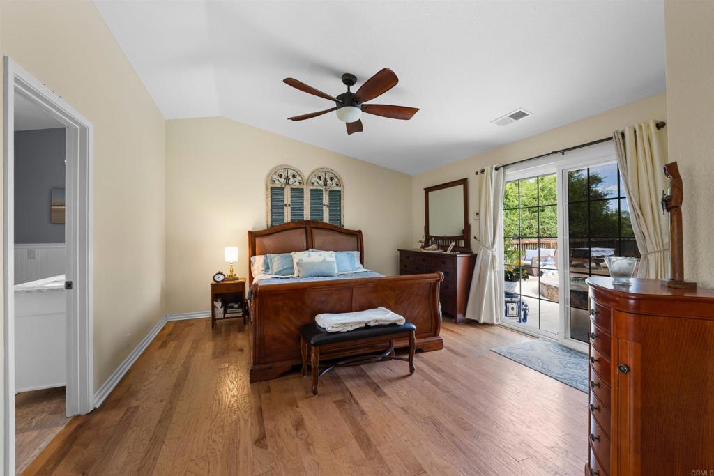 13995 Whispering Meadows Lane Jamul, CA 91935 - Photo 28 of 62 a living room with furniture and a flat screen tv