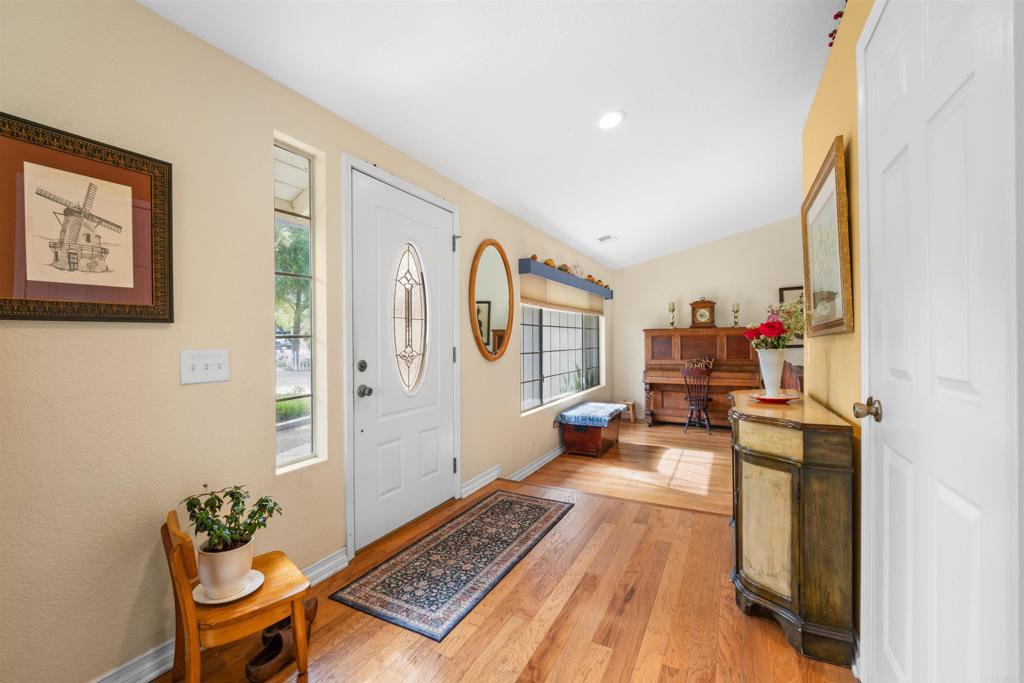13995 Whispering Meadows Lane Jamul, CA 91935 - Photo 3 of 62 a living room with furniture and a table