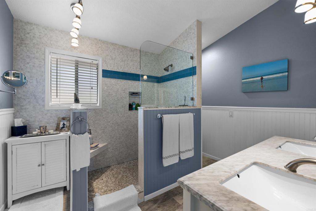 13995 Whispering Meadows Lane Jamul, CA 91935 - Photo 38 of 62 a bathroom with a sink a toilet and vanity