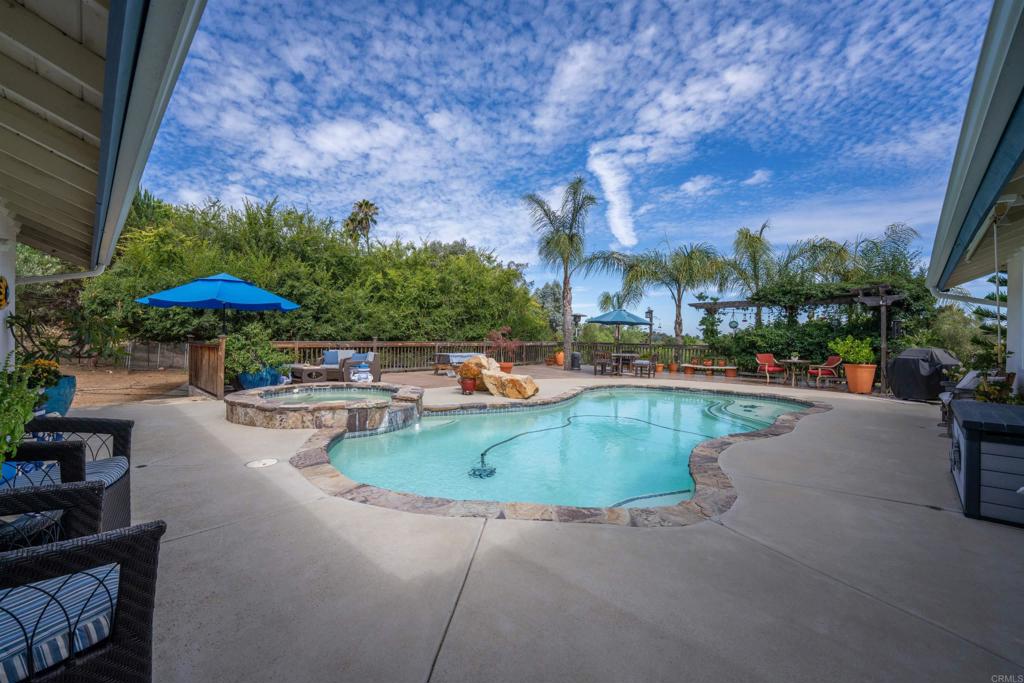 13995 Whispering Meadows Lane Jamul, CA 91935 - Photo 44 of 62 a view of a swimming pool with sitting area
