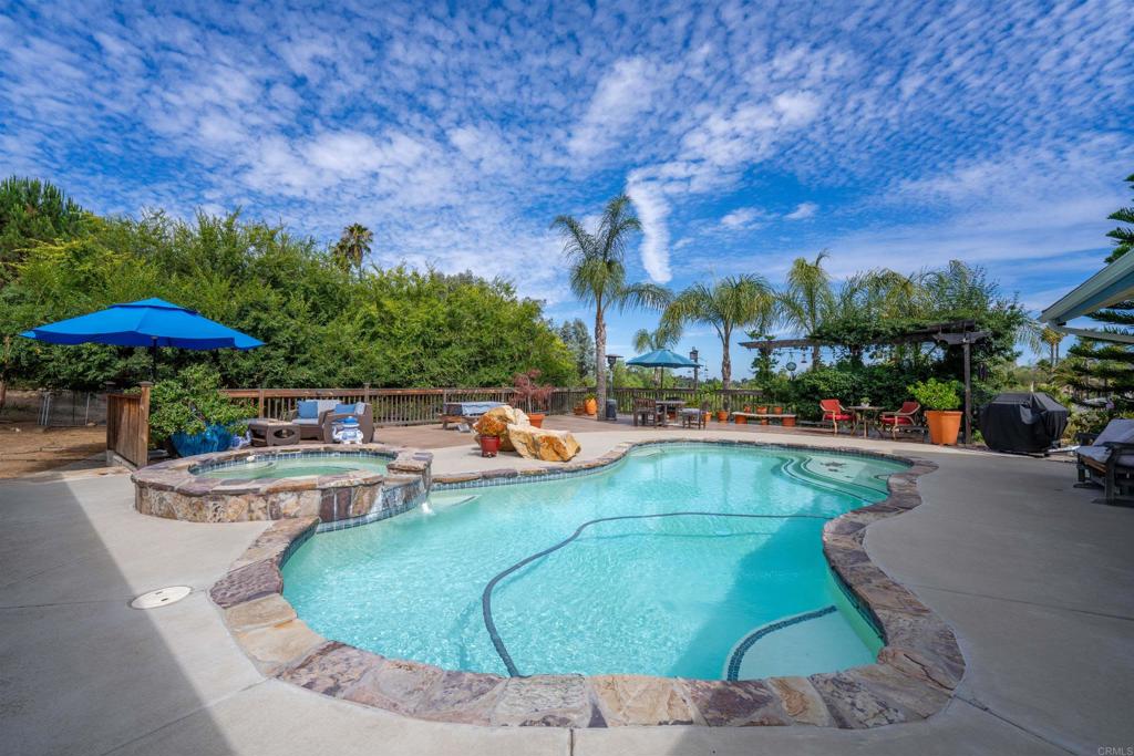 13995 Whispering Meadows Lane Jamul, CA 91935 - Photo 45 of 62 a view of a swimming pool with outdoor seating