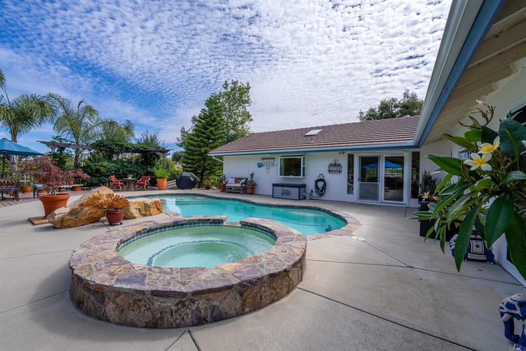 13995 Whispering Meadows Lane Jamul, CA 91935 - Photo 46 of 62 a view of a house with swimming pool and sitting area
