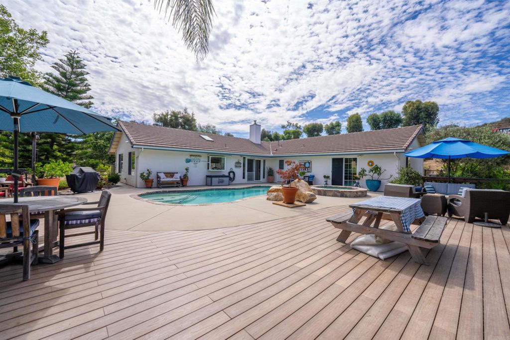13995 Whispering Meadows Lane Jamul, CA 91935 - Photo 49 of 62 a patio with sofas table and chairs