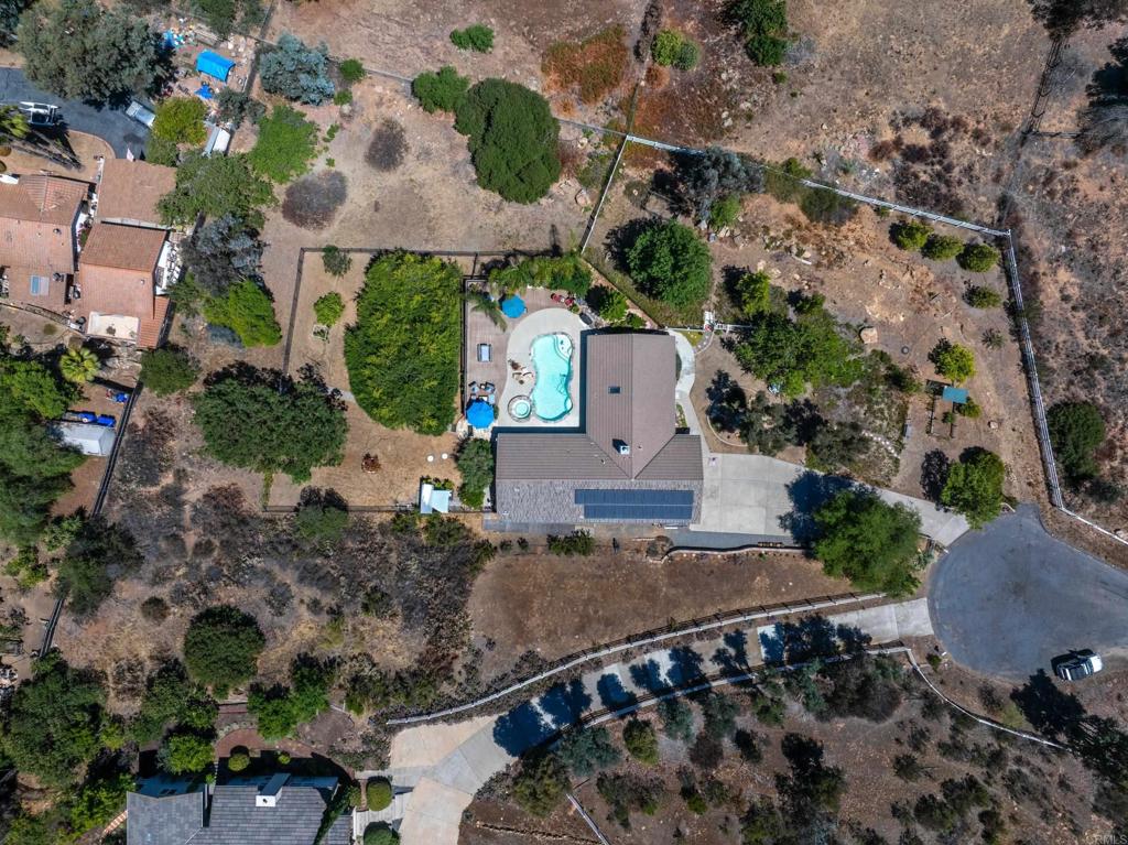 13995 Whispering Meadows Lane Jamul, CA 91935 - Photo 58 of 62 an aerial view of a house with a yard and potted plants