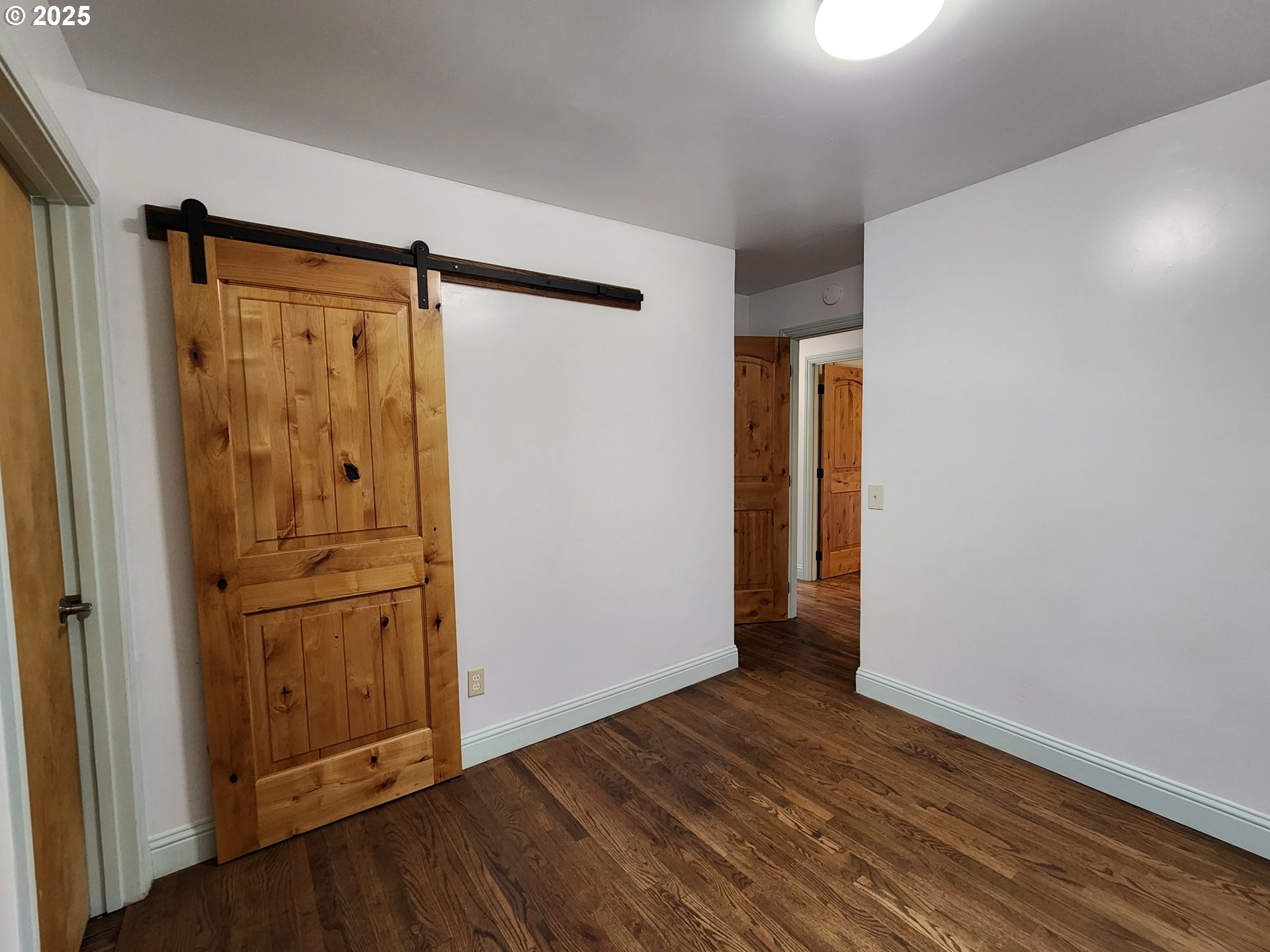 636 18th Street Port Orford, OR 97465 - Photo 19 of 29 an empty room with wooden floor and closet