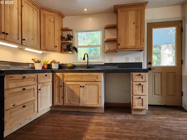 a kitchen with sink and window
