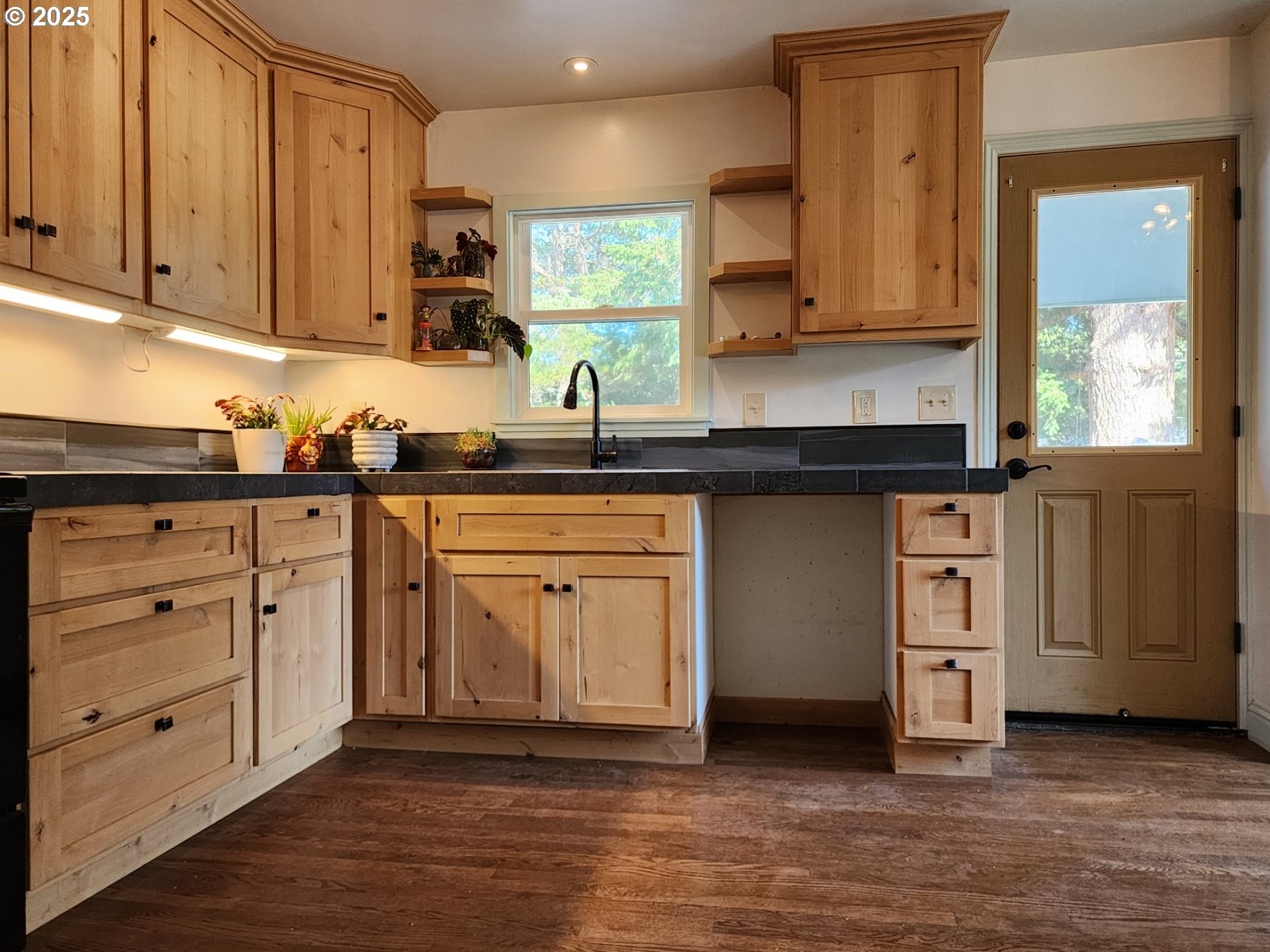 636 18th Street Port Orford, OR 97465 - Photo 7 of 29 a kitchen with stainless steel appliances granite countertop a stove a sink and a microwave