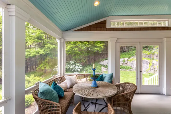 a outdoor dining space with furniture and garden view
